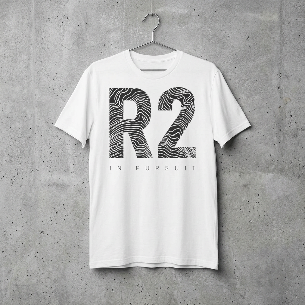 R2 'In Pursuit' Graphic Tee — Minimalist Monochrome Logo T-Shirt